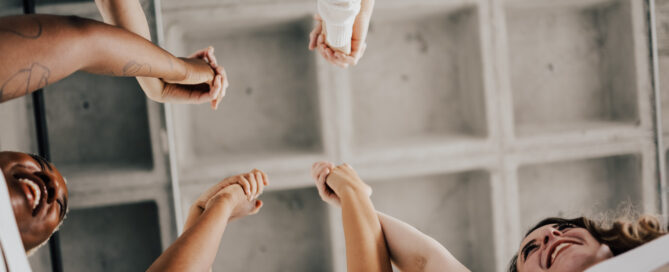 Students holding hands and supporting eachother