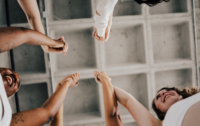 Students holding hands and supporting eachother