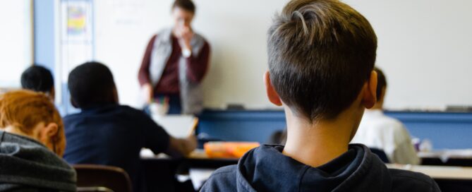 boy listening to teacher