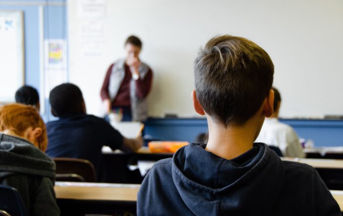 boy listening to teacher